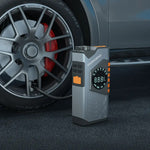 Car tire pressure monitor next to a car tire with visible branding.