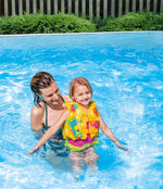 Woman and child in a pool with a colorful life jacket