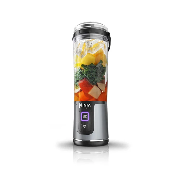 Ninja blender with ingredients inside on a white background