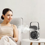 Woman sitting on a couch with a humidifier emitting steam in the background