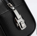 Water-resistant brown leather pouch with durable metal hardware.	حقيبة جلدية بنية مقاومة للماء مع قطع معدنية متينة.