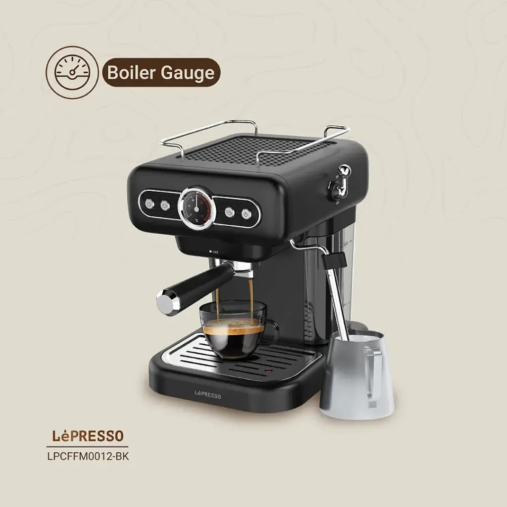 Retro coffee machine with one and two-cup filter accessories.