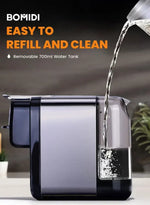 Demonstrating the self-cleaning function and the 700ML removable water tank.