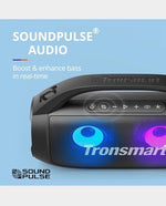 Side view of waterproof Tronsmart Bang SE speaker on outdoor surface.