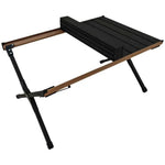 Compact folded Green Lion T3 camping table next to its portable carry bag.

طاولة التخييم جرين ليون T3 مطوية بشكل مدمج بجانب حقيبة الحمل المحمولة الخاصة بها
