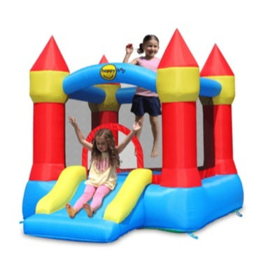 Children playing on a colorful inflatable castle bounce house with a slide.