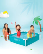 Children playing in an inflatable pool with a woman, palm tree, and sun in the background.