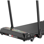 Foldable Taktik Pro treadmill in a small apartment space with wheels for easy moving.