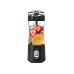 Black portable blender with fruits inside on a white background