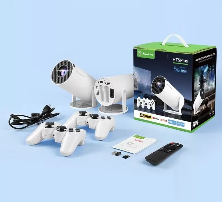 Smartbarry HT5Plus 4K Android projector with game pads displayed on a table