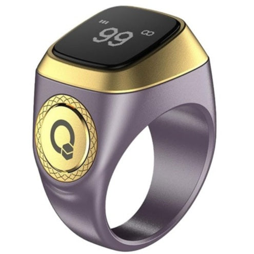 Smart ring with digital display and gold accents on a white background