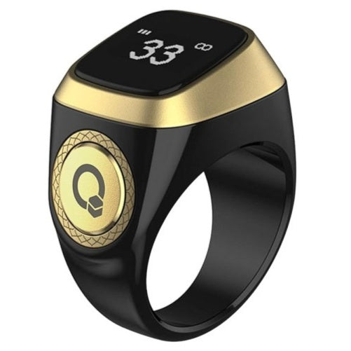 Black and gold smart ring with digital display on a white background