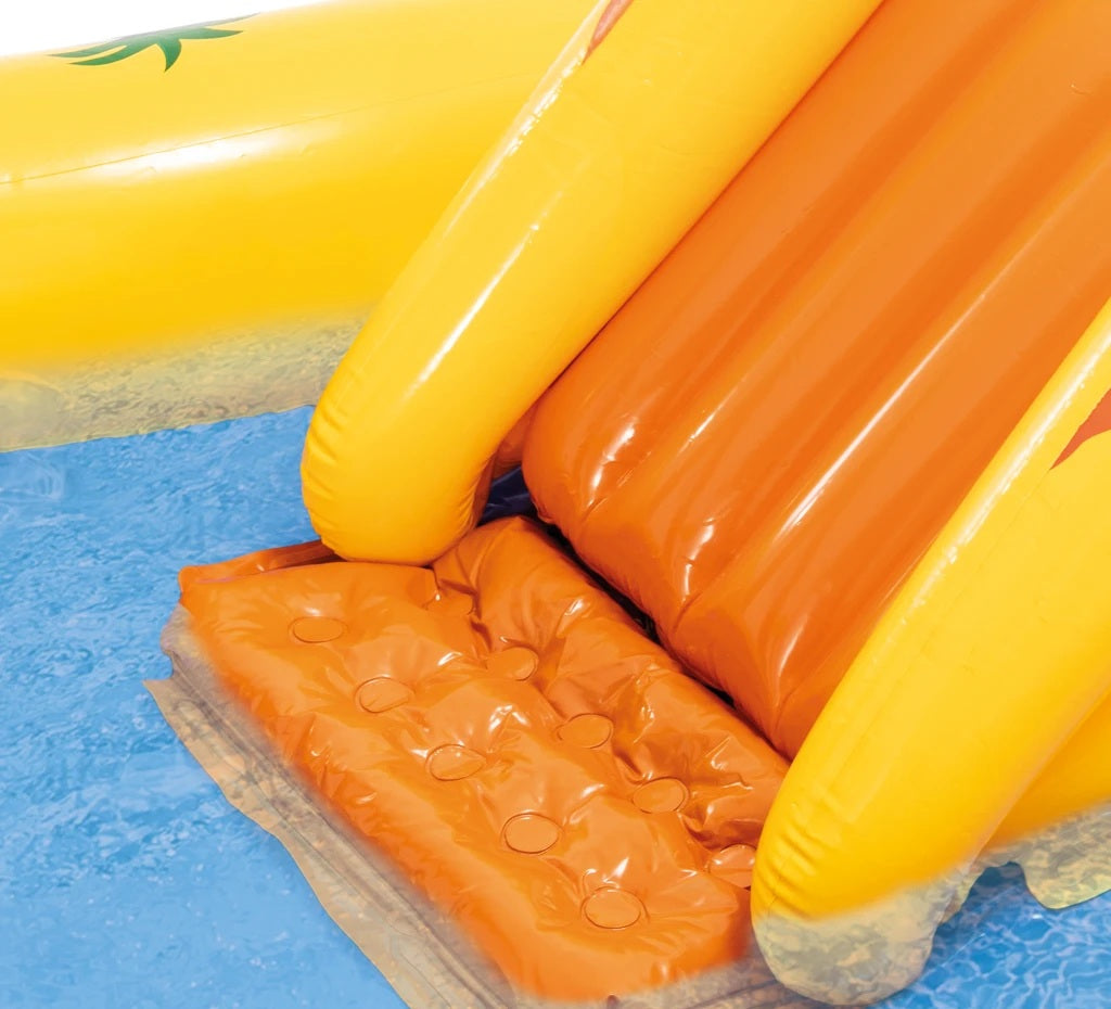 Inflatable pool toys including a yellow and orange float with a textured surface on a blue pool floor.