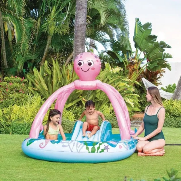 Inflatable octopus-themed pool with children playing in a garden setting
