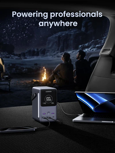 Laptop power bank charging a laptop with a desert scene in the background