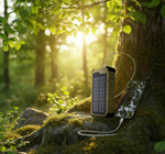 Solar charger attached to a phone in a forest setting