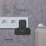 Black Porodo power adapter on a concrete wall with socket and cable.